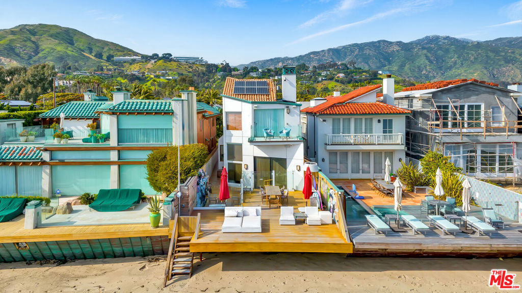 Nestled along the stunning Malibu coastline, this oceanfront estate is located in one of the most highly sought after beachfront communities in Malibu. Featuring a detached guest house complete with its own kitchenette, a lower-level office space, and a gorgeous deck overlooking the courtyard with unobstructed views. The primary en-suite bedroom features a private balcony, a soaking tub, and a large marble shower. The large sundeck has a heated spa and waterfall with direct access to Malibu's iconic beaches.