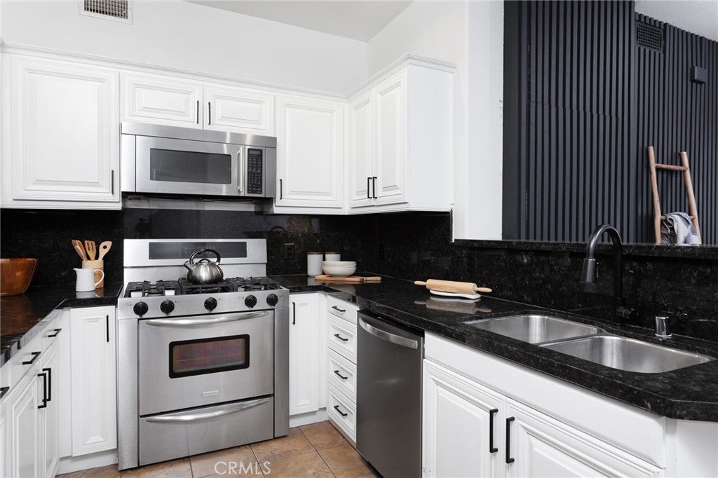 Photo of 3750 Santa Rosalia Drive #207, Los Angeles, CA 90008 (MLS # SB26154482)