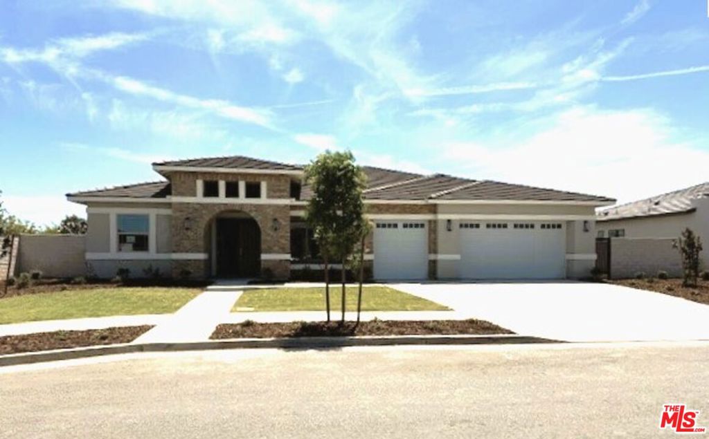 Stunning Mahogany Home. Located in the exclusive gated community of Belcourt Seven Oaks, this beautifully upgraded home offers 3 bedrooms, 3 bathrooms, an office, and formal dining across 2,617 sq. ft. of thoughtfully designed living space. Situated on a spacious 14,100 sq. ft. corner lot, this is one of only four homes remaining in this sought-after gated neighborhood. Step into luxury with upgraded quartz countertops and a large kitchen island, KitchenAid stainless steel appliances including double ovens, a 6-burner cooktop, microwave, and dishwasher. The elegant primary suite features a spa-like bathroom with a fully tiled walk-in shower, dual shower heads including a rain shower, and framed mirrors. Enjoy indoor and outdoor living with both fireplaces and LED lighting throughout the primary bedroom, kitchen, family room, office, and formal dining. All bedrooms, the office, and the family room are pre-wired and braced for ceiling fans. This energy-efficient home includes owned solar with battery, an incredible value included in the price. Located near top-rated schools, popular restaurants, boutiques, and coffee shops, this home blends luxury, convenience, and sustainability. Don't miss your chance to own this exceptional property in Belcourt Seven Oaks!