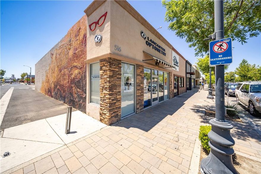 Positioned at a highly visible corner in the heart of The BLVD, Lancaster’s premier downtown district, 516 W Lancaster Blvd offers a rare opportunity to lease prime commercial space in one of the Antelope Valley’s most dynamic and walkable corridors.

Surrounded by a vibrant mix of restaurants, boutique retailers, galleries, and entertainment venues, this property is ideally suited for retail, professional/medical office, fitness, health/wellness, or creative uses. The flexible layout makes it an excellent fit for businesses seeking a turn-key location in a thriving downtown environment.

The space features a spacious open showroom, four private rooms, restroom, and a large finished basement (not included in square footage), complemented by an impressive window line that enhances visibility and floods the interior with natural light—creating an inviting, functional environment for a wide range of tenants.

Additional highlights include six dedicated on-site parking spaces, plus ample public parking directly behind the building.

With strong foot traffic, excellent exposure, and close proximity to the Metro Station and Sierra Highway, this location offers exceptional convenience and connectivity for customers, employees, and commuters alike.

Don’t miss this opportunity to lease premium space in Lancaster’s revitalized and growing downtown district—perfect for businesses looking to establish a strong long term presence on The BLVD.