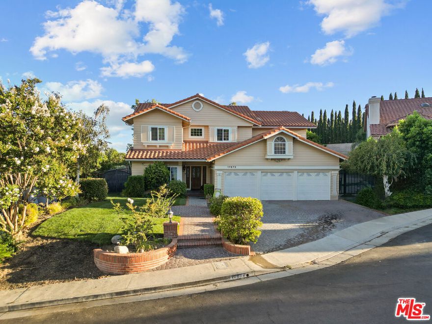 Move right in to this fully furnished Granada Hills estate, newly refreshed with fresh paint, updated flooring, and lush new grass. Perfectly situated at the top of a cul-de-sac, this residence offers 4 bedrooms and 4 bathrooms, including a convenient downstairs bedroom, plus three additional bedrooms upstairs with a versatile loft/gym space. Interiors are bright and inviting with high ceilings, three fireplaces, and an open-concept kitchen with Miele stainless steel appliances and a center island. The living and dining rooms are tastefully furnished for both comfort and style, while a billiard room, office, and in-home fitness equipment add versatility. Step outdoors to a private retreat designed for entertaining: a sparkling pool and spa, expansive patios, hillside views, and fresh landscaping that set the scene for both relaxation and gatherings. A two-car garage plus additional parking completes this exceptional lease opportunity. This home combines luxury, lifestyle, and convenience, near top-rated schools, offering a true turnkey furnished lease in one of Granada Hills' most desirable neighborhoods.