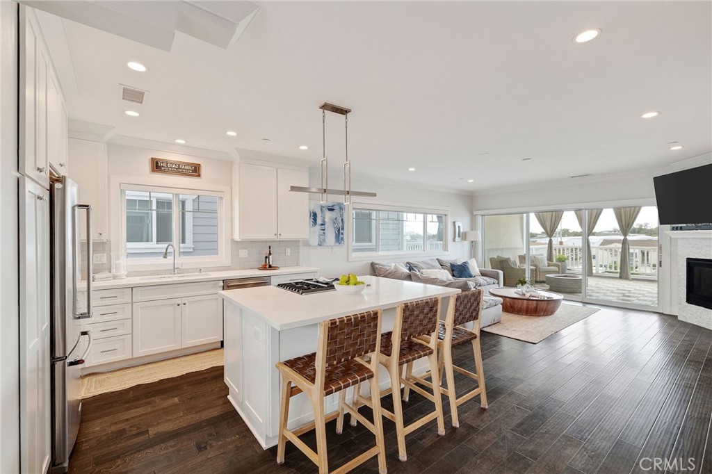Built in 2018, this gorgeous open concept townhome is located in a small gated community of only 6 units in North Torrance . Walk into the first level through your own gated front yard and private entrance with direct access to a huge 3 car garage with custom storage and a half bath. The third car space in the garage can easily be converted to a home office/ gym. The second floor great room features large windows which allow natural light to pour into the space. The kitchen has built-in Kitchen Aid stainless steel appliances, a kitchen island with a breakfast bar, and quartz stone counter tops. The great room’s stacking glass doors open to a large outdoor covered deck which extends the living area to the outside and is perfect for taking advantage of sunny Southern California's indoor outdoor lifestyle. The spacious great room also has a dining area, fireplace and half bath for guests. The third floor offers a large master with 5 piece en-suite. Two additional bedrooms with vaulted ceilings, a full bathroom and laundry round out the second floor. Dark walnut hardwood floors, air conditioning and tankless water heater, double paned Milgard windows with custom cellular blinds, ceiling fans are included amenities. Located in North Torrance, with easy access to the beach, great restaurants, close to shopping, freeways, and distinguished Arlington Elementary School.