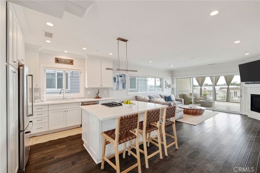 Built in 2018, this gorgeous open concept townhome is located in a small gated community of only 6 units in North Torrance . Walk into the first level through your own gated front yard and private entrance with direct access to a huge 3 car garage with custom storage and a half bath. The third car space in the garage can easily be converted to a home office/ gym. The second floor great room features large windows which allow natural light to pour into the space. The kitchen has built-in Kitchen Aid stainless steel appliances, a kitchen island with a breakfast bar, and quartz stone counter tops. The great room’s stacking glass doors open to a large outdoor covered deck which extends the living area to the outside and is perfect for taking advantage of sunny Southern California's indoor outdoor lifestyle. The spacious great room also has a dining area, fireplace and half bath for guests. The third floor offers a large master with 5 piece en-suite. Two additional bedrooms with vaulted ceilings, a full bathroom and laundry round out the second floor. Dark walnut hardwood floors, air conditioning and tankless water heater, double paned Milgard windows with custom cellular blinds, ceiling fans are included amenities. Located in North Torrance, with easy access to the beach, great restaurants, close to shopping, freeways, and distinguished Arlington Elementary School.