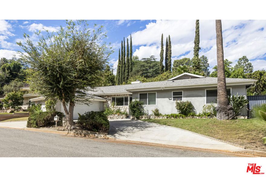 Set near the end of a cul-de-sac on desirable Royal Ridge Road in Sherman Oaks, this spacious 4-bedroom, 3.5-bathroom home offers 2,692 square feet of well-designed living space including a versatile 7.5' x 10' bonus room off of the living room, ideal for an office, gym, or playroom. This is a great family home that balances comfort and function with thoughtful details throughout. The entry feeds into light-filled living areas featuring two fireplaces and newer floors which create a fresh, inviting atmosphere. The kitchen flows easily to the dining area, making it perfect for everyday living or entertaining. A wet bar in the living room adds convenience when hosting gatherings. The primary suite provides a private retreat, while three additional bedrooms allow space for family, guests, or a home office. Bathrooms are well-appointed, offering both style and practicality. Step outside to a large pool and patio area, perfect for summer fun and relaxation. The yard takes advantage of the 8,893 sq ft lot. With its two-car, attached garage, ample storage, and flexible floor plan, this home is designed for modern living. Located in a sought-after Sherman Oaks, 15508 Royal Ridge Rd combines suburban comfort with easy access to local shops, dining, and freeways. Trust Sale.
