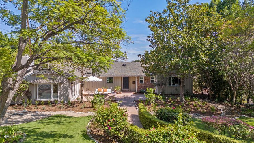 This updated Mid-Century Ranch feels completely tucked away on an idyllic, tree-lined street, despite its close proximity to charming downtown Sierra Madre. The home's layout is intuitive for a small crowd keen on entertaining. The open-concept great room shows off views of the serene yard with its sparkling pool, a brick fireplace, crown moulding, and recessed lighting. The bright, open-air kitchen is lined with custom solid wood cabinets, dovetail and soft-close drawers, a suite of Thermador appliances, a wine fridge, and a Miele steam oven. Just off the kitchen, you can keep everything organized in the walk-in pantry and the handsomely appointed laundry room. The south side of the home includes three spacious bedrooms, all filled with natural light, and two 3/4 baths. The north side of the home offers a bonus room with vaulted ceilings, a closet, a fireplace, and a half bath, which could easily function as a secondary suite. The primary suite boasts dual sinks, a freestanding tub, a truly incredible amount of closet space, vaulted ceilings, and glass French doors that lead out to the back patio. The primary suite and the great room open up to the expansive backyard, offering you that coveted indoor-outdoor flow that's as ideally suited for entertaining as it is for quiet contemplation. Spill out onto the pergola-covered brick patio with its built-in gas BBQ and mini fridge, take advantage of the flat lawn, play in the black bottom pool, and rinse off in the cabana's 3/4 bath. The split-level backyard offers even more space for you to get creative, perhaps with gardening beds, a playground, or both. The home has seen many updates, including remodeled baths and kitchen, new floors, doors, and windows, updated pool equipment, a whole home generator, a tankless water heater, and more. 180 S Mountain Trail shows off clear views of the San Gabriel mountains, with a setting that puts you just minutes away from local favorites like Syndicate, Emmi's, Lucky Baldwin's, Wistaria, and the Buc, as well as parks, the Mount Wilson Trail, the Arboretum, Santa Anita Park, and Westfield Santa Anita.