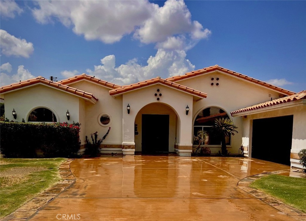 Single Story Beauty in the Heart of La Quinta. Price reduced to sell!! Close to great golf courses and clubs along with local dining areas. Great neighborhood. This stunning home offers 2682 sq ft of spacious living space on a generous 13,939 sq ft leveled lot. Home sits in the middle of the lot which allows a large wide driveway and lovely fenced front yard. Perfect for the kids or pets. The interior offers 4 bedrooms and 3 bathrooms. Nice kitchen that opens to the family room which allows plenty of space for your guest to be entertained. Good size formal dining room. Plenty of windows that allow plenty of natural light. Higher ceilings in family room, kitchen area and dining areas. Large master suite with it's own master bathroom with separate shower and soaking tub along with a double vanity and walk in closet. The other bedrooms offer plenty of space for family and guest. Step into the backyard with a grass area with citrus trees, pool with and relaxing spa and concrete patio area with plenty of room to entertain and dine or BBQ. Great view of the mountain nearby. Ready for your personal touch, this home can really shine with a little TLC. Make it your own and build great equity. Price to sell!! Plenty of space for an ADU, buyers to do their own due diligence. NO HOA