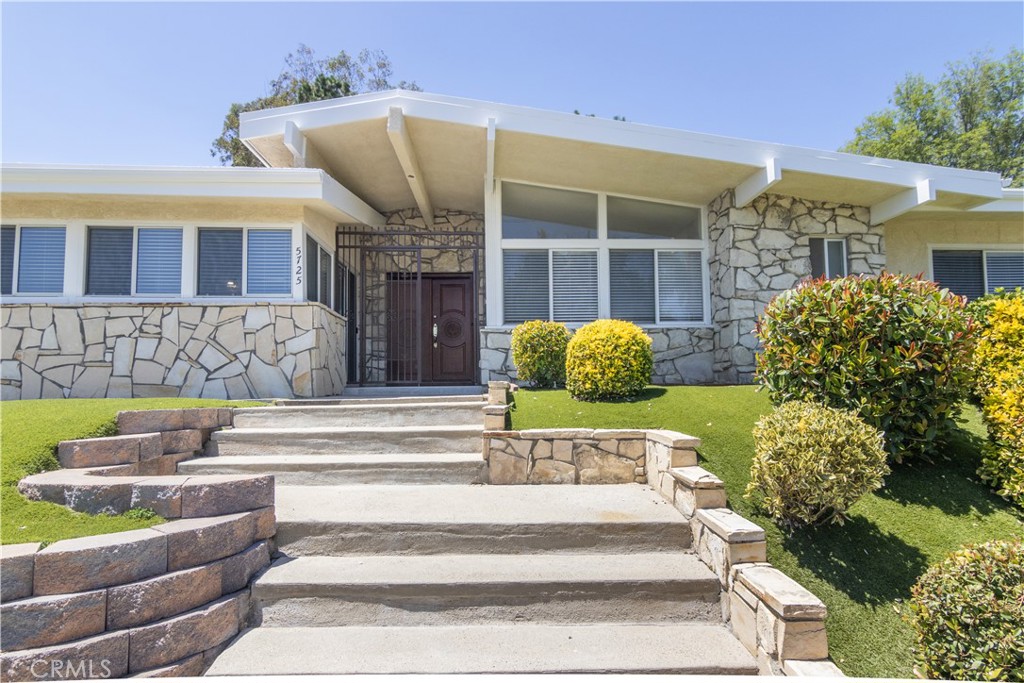 Welcome to this beautiful Charles Du Bois home featuring a bright, open layout that exudes charm and warmth. Nestled on a quiet street in Woodland Hills, this charming residence offers 3 spacious bedrooms and 2 stylish bathrooms, including a private ensuite in the primary bedroom. Enjoy cooking and entertaining in the thoughtfully designed kitchen featuring granite countertops, ample cabinetry, and a dining nook area. Gorgeous wood floors flow throughout the home, completing the bright and airy layout and dual fireplace. The entertainer's yard is perfect for your gatherings, with a large swimming pool which was newly re-plastered and pristine landscaping that adds to the home's inviting appeal. This home also includes a bonus office space just off the kitchen, filled with natural light from its many windows. Great cul-de-sac neighborhood close to all the shops, commons and El Camino High school.