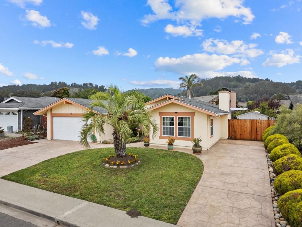 Charming ranch-style home nestled at the end of a quiet cul-de-sac on an oversized 7,000 sq/ft lot. This 3-bedroom, 2-bath gem features a spacious living room with a cozy fireplace, perfect for gatherings. The primary suite offers comfort and privacy, while two additional bedrooms provide flexibility for guests or a home office. A modern open concept kitchen opens to a breakfast nook and dining/family room. Enjoy a beautifully landscaped, drought-tolerant backyard with two planter boxes ideal for gardening or relaxing outdoors. Recent updates include custom stamp driveway, new carpet, fresh interior paint, and new closet doors. Located just minutes from major transportation routes, the vibrant shops and restaurants of downtown, and the stunning beaches of Half Moon Bay. A wonderful blend of comfort, convenience, and coastal living!