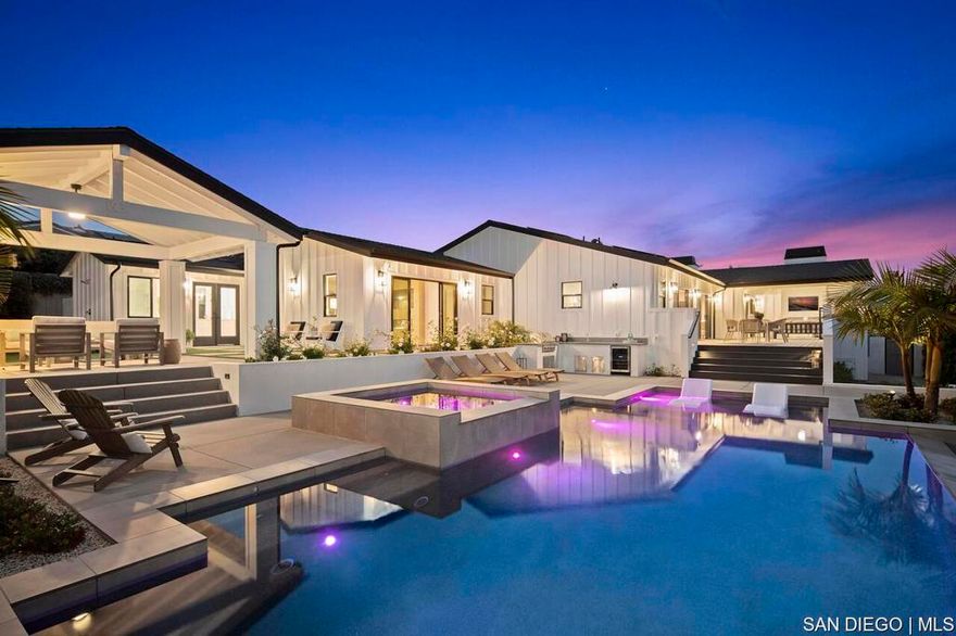 Coastal Dream Home with Sweeping Ocean Views- newly built (2023) , single-level gated estate perched above the coast. With 4 bedroom suites + office, 4.5 baths, and a separate 1 bed/1 bath (800sqft) guest house (ADU), this property blends laid-back luxury with modern design just minutes from the beach, downtown Carlsbad, and top-rated schools. Enjoy panoramic ocean and sunset views from nearly every room matched with a calming ocean breeze. The heart of the home is a glowing Great room with soaring wood-beamed ceilings, a statement fireplace, and wide-open covered patios made for year-round indoor/outdoor living. The chefs kitchen is a showstopper: 48" Wolf gas range, Subzero refrigeration, Miele coffee station, dual dishwashers, wine and beverage coolers, a custom waterfall island, and a secondary butlers kitchen with walk-in pantry. The primary suite is a pure retreat opening directly to the pool and spa with ocean views, and featuring a spa-inspired bath with heated Carrera floors, wet room with soaking tub and dual showers, plus custom his-and-hers walk-in closets. Guest suites open to a peaceful private courtyard with luxe ensuite baths. Step outside and you'll find your own slice of resort living: vanishing edge pool, built-in spa, cabana lounge, BBQ bar, Trex decking, and over (800 sqft) of covered outdoor space perfect for golden hour gatherings. The private guest house is next-level, with ocean views stretching from La Jolla to Catalina, its own kitchen and living space, bedroom opening to a lanai with a summer kitchen, and total privacy. Extras include: 4 fireplac