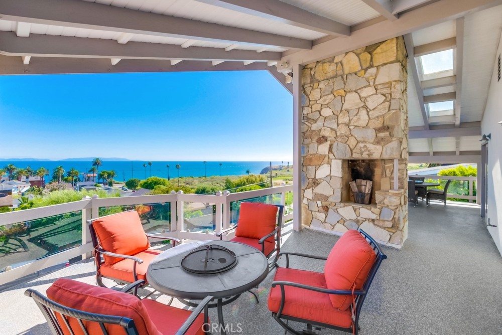 Welcome to the tranquil Palisades neighborhood of San Pedro, where this elevated home offers panoramic views of Catalina Island and the ocean. Upon stepping onto the recently enhanced oversized balcony, adorned with slate stone, stacked stone and glass fences, you'll immediately be captivated by the natural beauty that surrounds you.
Inside, the home has been refreshed with new paint and updated appliances, creating a contemporary and welcoming atmosphere. The living room seamlessly connects to the outdoors through sliding doors, providing a serene space to relax and unwind.
Upstairs, you'll find three bedrooms and two bathrooms. The expansive primary suite features sliding doors opening to a wrap-around balcony, inviting you to enjoy the sweeping vistas. Its ensuite bathroom boasts a shower, soaking tub, and spacious vanity for a luxurious experience.
Sharing access to the balcony, the second bedroom also offers stunning views of Catalina and the ocean. Meanwhile, the recently remodeled shared bathroom exudes modern elegance with its black-and-white finishes and relaxing soaking tub.
Outside, the backyard beckons with lush greenery and panoramic Catalina Island views, complemented by thriving avocado, olive, and lemon trees.
Completing this coastal haven is a three-car garage, one of which includes a convenient 3/4 bath and kitchenette, perfect for conversion into a studio space. This bonus room adds approximately 285 sqft. With nearby hiking trails and easy access to Paseo Del Mar and White Point Beach, this location invites you to immerse yourself in the natural beauty and tranquility of the surroundings.