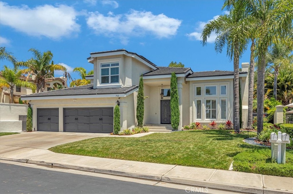 Exquisite Luxury Behind the Gates of Belsomet. Welcome to this exceptional residence nestled within the prestigious 24-hour guard-gated community of Belsomet in Anaheim Hills. Set on a meticulously landscaped 10,200 sq ft lot, this elegant single-family home offers approximately 3,097 sq ft of refined living space, featuring four bedrooms including a versatile main-level room currently used as a custom office and three full bathrooms. A rare blend of privacy, comfort, and upscale living awaits. Extensively remodeled with over $500,000 in high-end upgrades, the home showcases new hardwood flooring, solid wood interior doors, custom French doors, fresh designer paint, upgraded lighting, and wrought iron staircase. The re-imagined kitchen features custom cabinetry, quartzite countertops, and high end Monogram Appliances, while the bathrooms have been luxuriously updated with porcelain tile, custom finishes, and frameless glass enclosures. The primary suite is a tranquil retreat with a spa-like bath featuring marble tile, a soaking tub, and walk-in shower. Additional upgrades include a recently replaced HVAC system with dual compressors and furnaces, new water heater, fully custom closets in all bedrooms, and three beautifully retiled fireplaces including an electric fireplace in the primary suite. The laundry room and garage have also been meticulously updated with premium finishes and thoughtful touches throughout. The exterior is equally impressive with fresh paint, new lighting, a new tile roof, and a new solar system (both of which will be paid off by the seller through escrow at closings). The resort-style backyard features a newly renovated Pebble Tec pool with Baja shelf, updated lighting, a removable safety fence, Sonos sound system, and ample space for outdoor entertaining, including a dedicated basketball area and kids playground set. The grounds have been professionally landscaped with new grass, plants, and a modern sprinkler and drip system covering the hill, front, and side yards. Perfectly located near top-rated schools, shopping, dining, parks, and freeways, this turnkey home offers a rare opportunity to own in one of Anaheim Hills' most sought-after communities.