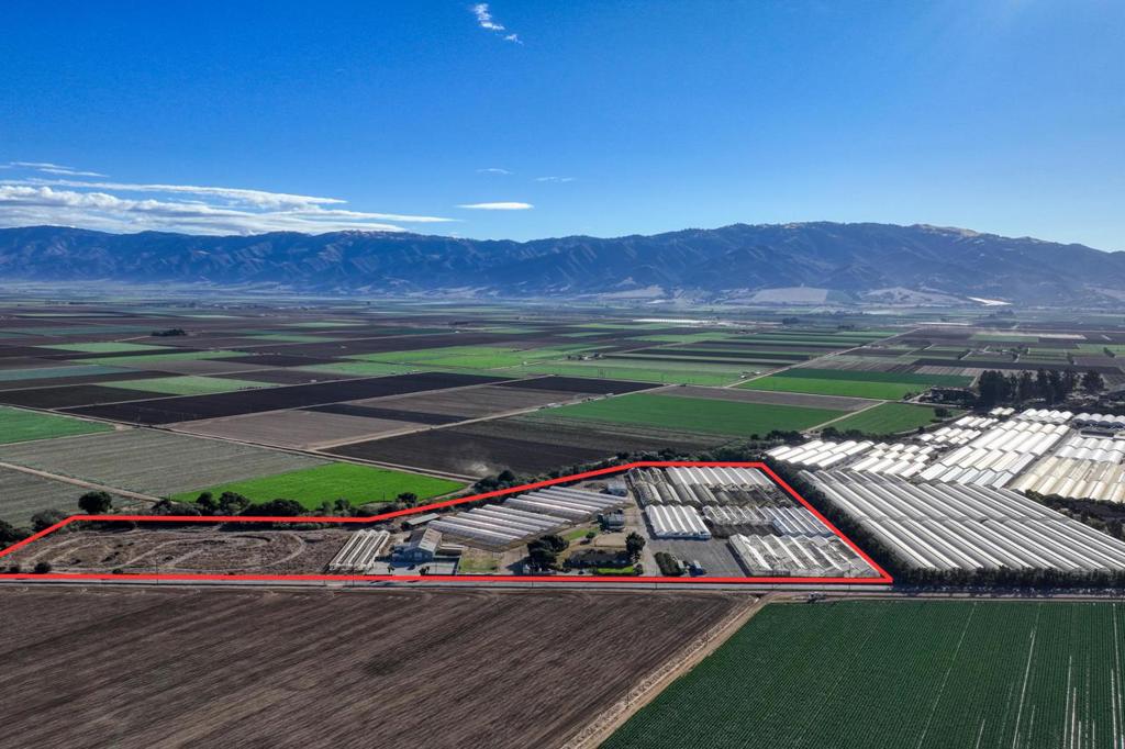 For sale in the heart of California's agricultural Salinas Valley, 26000 Encinal Rd offers a unique 21.25-acre property across two parcels, ideal for diverse agricultural pursuits. The property includes 341,000 square feet of greenhouse space, featuring wood-frame and modern IDG structures that suit large-scale cultivation needs. A spacious 4,446 sq. ft. residence with five bedrooms and 2.5 bathrooms provides a comfortable on-site living option. Multiple outbuildings serve as flexible spaces for storage, workshops, or operational support. Previously utilized as a cannabis operation, this property is a prime opportunity for agricultural entrepreneurs or those seeking entry into the cannabis industry, given its infrastructure and expansive acreage. Located in the fertile Salinas Valley and surrounded by a thriving agricultural community, 26000 Encinal Rd is well-positioned for growth and innovation.