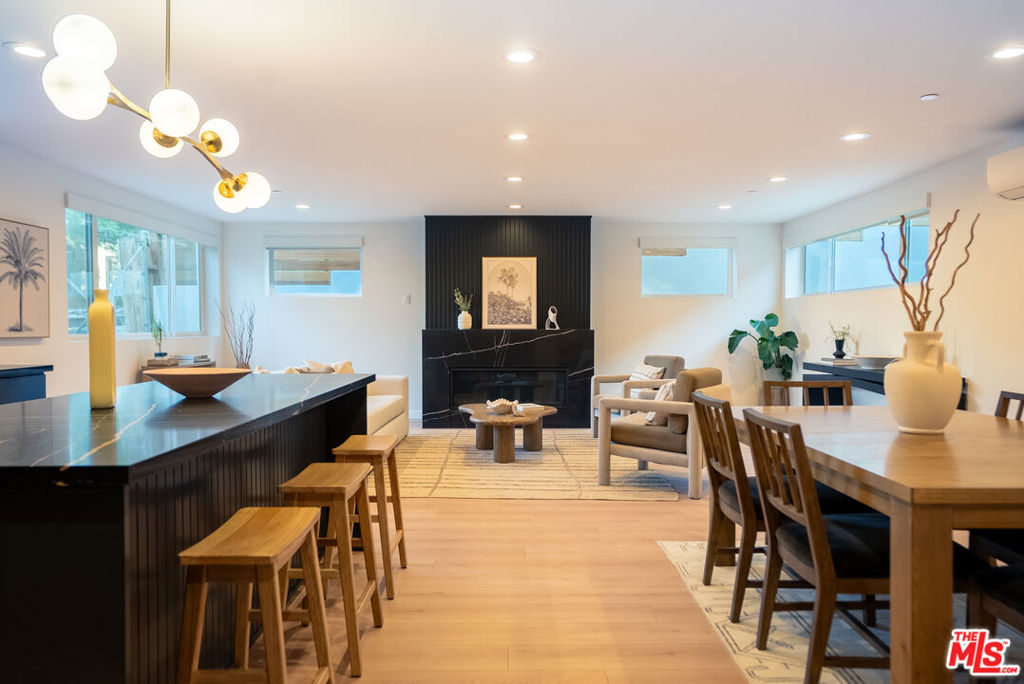 Welcome to a brand-new modern residence perfectly positioned on the Silver Lake side of the vibrant Silver Lake/Echo Park border. Thoughtfully designed with luxury finishes throughout, this 2 bedroom, 2 bathroom home blends contemporary style with everyday convenience. The open concept living room and dining area is bright and airy, featuring white oak laminate floors and oversized windows that flood the space with natural light. An oversized fireplace provides the perfect balance of a modern and cozy touch. The sleek designer kitchen boasts stainless steel appliances, custom cabinetry, and a spacious island perfect for cooking, entertaining, and storage. Both bedrooms accommodate king beds, with walk-in closet in the main bedroom, while the bathrooms feature a hallmark blue tile lining the shower boxes. Additional amenities include brand new wall A/C splits, in-unit laundry, gated parking with automatic powered gate, complimentary trash service, and professional management. The landscaping features native, drought-tolerant selections maintained by a master-level gardener.Step outside and embrace the best of both neighborhoods. Walk across the street for a class at Modo Yoga and start your day with a cold plunge and sauna. Grab coffee and stroll the Silver Lake Reservoir or lay out at the Meadow for some sun. Bike along the LA River path to Griffith Park, swing by the Red Lion Tavern for a beer, or head to Atwater for handmade pasta at Spina. With Erewhon close by and a new Sprouts opening down the street, easy access to the 2, 5, and 101 freeways, and Sunset Blvd around the corner, you'll be perfectly positioned to enjoy one of LA's most dynamic neighborhoods. Designer-selected furniture and move-in ready packages available. Dogs considered with additional monthly rent.
