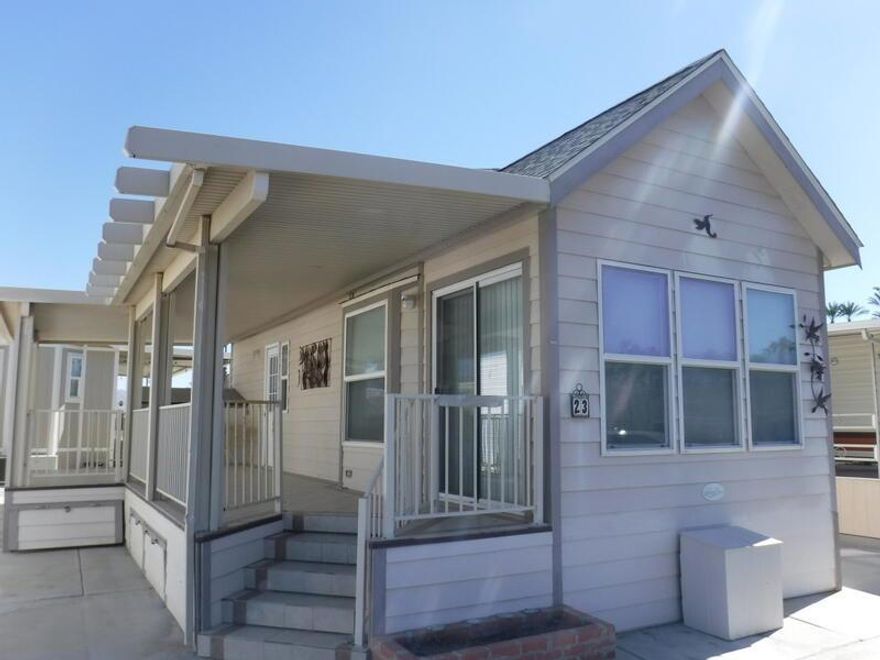 This is a lot within the the Happy Wanderer DBA Indio Springs RV resort. 55 plus park.  Lot has a 2009 Laure Park model RV with a nice deck and shed on the lot. Lot and RV are being sold ''as is were is'' RV features 1 bedroom 1 bath room, full kitchen, living room, small dining area, this unit also has a loft above the kitchen area. Very nice clean unit. You own the land. The RV is licensed thru the DMV. The resort has 2 community pools and 1 Spa, Chipping Green, Pickleball, Tennis, Craft rooms, Card rooms. Large community ball room. Library and very nice relaxing sitting area with a large fireplace. Very close to Starbucks and Grocery stores, Banking, Fast foods, Gas stations, Texas Roadhouse etc.