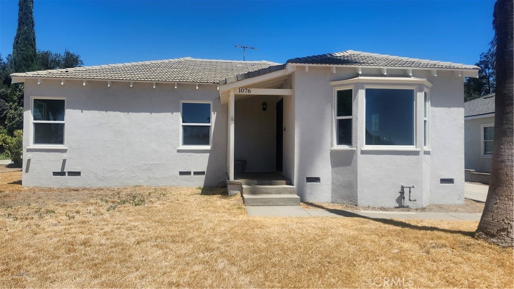 Nice clean three bedroom one bath home with large back yard, two car garage, freshly painted, new windows, original oak floors, move in ready