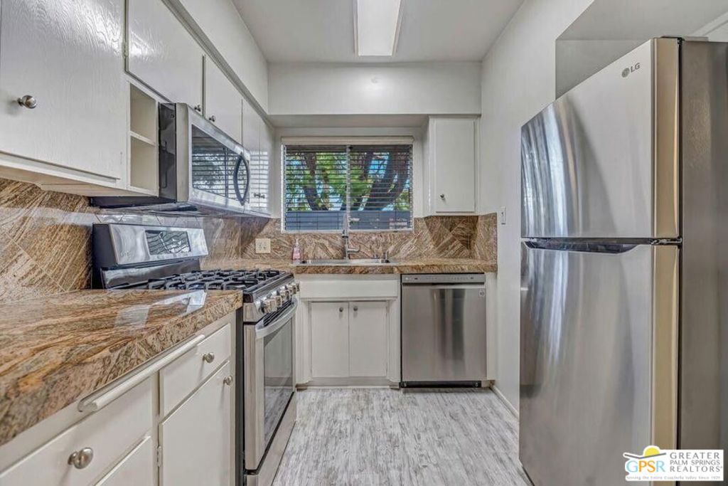 Resort-style living in the heart of Palm Springs! This unfurnished 2 bedroom, 2 bath single-level condo offers the perfect blend of mid-century charm and modern comfort. Located in the historic Desert Lanai community designed by renowned architect Charles Du Bois and built by the Alexander Construction Company you'll be surrounded by the timeless style that makes Palm Springs famous. Inside, the condo features granite tile countertops, stainless steel appliances with a gas stove, wood-look vinyl flooring, tiled bathrooms, and ceiling fans throughout. Two patios provide outdoor living options: one with a pool view and another more private space to relax. Covered parking and storage are included. The beautifully landscaped grounds showcase a sparkling pool framed by breathtaking mountain views, creating a true desert oasis. All just minutes from downtown, the Convention Center, and Spa Casino where dining, shopping, and entertainment are right at your fingertips. Rarely available in Desert Lanai II don't miss the chance to call this iconic Palm Springs community home!