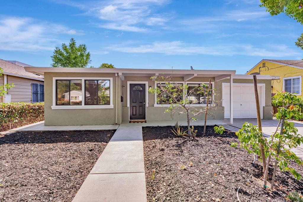 Welcome to this move-in ready, updated single-family home in Menlo Park, ideally located near the Meta campus. This light-filled home features an open floor plan, perfect for both everyday living and entertaining. The updated kitchen includes stainless steel appliances, ample counter space, and plenty of storage. The home features double-pane windows, fresh interior paint, and laminate flooring throughout. Both bedrooms are spacious, and the updated primary bathroom offers a clean, contemporary feel. The garage has been converted into a bonus living space with its own bathroom and private entrance. It can be used as a home office, third bedroom, or possibly rented for additional income. (Not included in the official square footage and can be converted back if desired.) Step outside to a large backyard designed for entertaining, complete with raised garden beds ready for your own vegetable garden or can be used to expand the home in the future. Located close to Meta campuses, Stanford University, and the vibrant Belle Haven Community Center, which features two pools and a public library. Major transportation routes and commuter options are just minutes away.