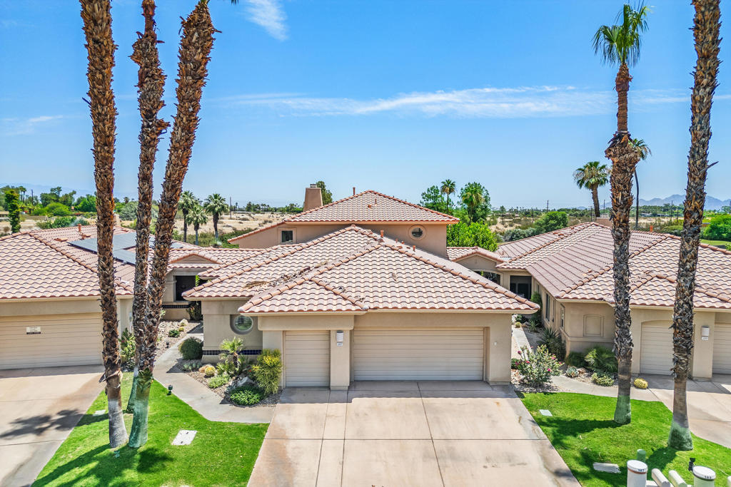 Welcome to Rancho Mirage CC... one of the very desirable centrally located communities in Rancho Mirage. This stunning home is one of the most gorgeous remodeled properties in all of Rancho Mirage CC. At 3,219 sq ft, this unit is only one of 8 and is the largest in RMCC with OWNED SOLAR. Elegant and stylish colors and finishes are evident from the custom front double doors all through this very special home. Dramatic lighting enhances the relaxing ambiance throughout. There is a beautiful home office as well as three bedrooms each with their own bath all updated and upgraded. A chef's kitchen has gorgeous quartz counters, high-end stainless appliances and open to a spacious patio that overlooks a lovely lake, greenbelt & golf course where you can also play ten-holes of golf too! The Master Suite has a fabulous bathroom and large walk-in closet. The curved stairway leads to a delightful loft upstairs perfect for reading or relaxing as well as a luxurious bedroom and bath. This home is move-in ready for you to enjoy the best of indoor and outdoor desert living. New Lennox HVAC/Furnace units. A community pool is steps away or you can have your own private pool installed in the large backyard. This community is ideally located in Rancho Mirage and is next door to Eisenhower Medical Center. Shopping, Dining and Entertainment such as 'The River' and the El Paseo Shopping and Dining District are a short drive away. This home has it all and can be either your perfect seasonal retreat or your full-time sanctuary. Don't miss out on this one!