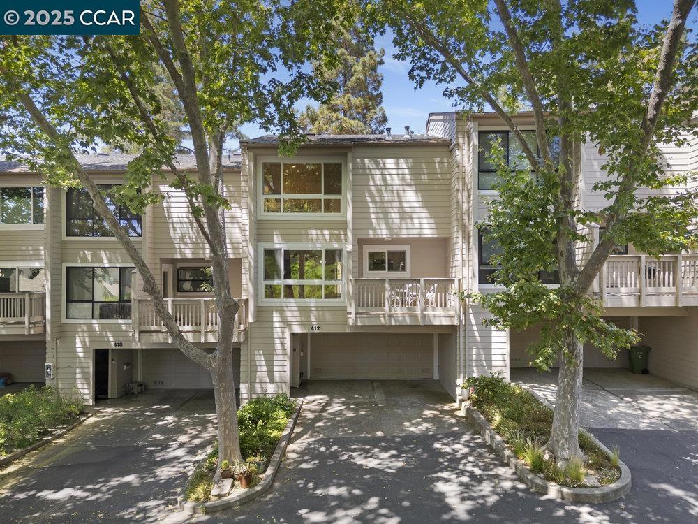 Don’t miss this beautifully updated townhome located in Moraga’s sought-after Woodminster community. This 3BR/2.5BA multi-level home lives like a single-family residence, with expansive dual pane windows offering serene views & abundant natural light throughout. The open living area features a gas fireplace, hardwood floors & flows seamlessly to a large deck—perfect for entertaining or relaxing among the trees. The modern kitchen boasts granite countertops, SS appliances, & pantry, along with a sunny breakfast nook & attached deck, perfect for your morning cup of coffee & some afternoon alfresco dining. Upstairs, three spacious bedrooms include a light-filled primary suite w/a walk-in closet & two additional bedrooms with custom black out shades. Not to be overlooked is the “fully finished,” attached two car garage that features, epoxy floors, custom cabinets, bike storage, laundry hookups, utility sink & a great spot for your home gym! Other recent upgrades include dual pane windows & doors, LED recessed lighting, fresh paint & hardwood floors. Enjoy community amenities like a remodeled pool, clubhouse & ample guest parking. Nestled near top-rated Moraga schools, Moraga Commons park, Sunday Farmer's markets, hiking/biking trails, & steps from the Rheem Theatre & shopping center.