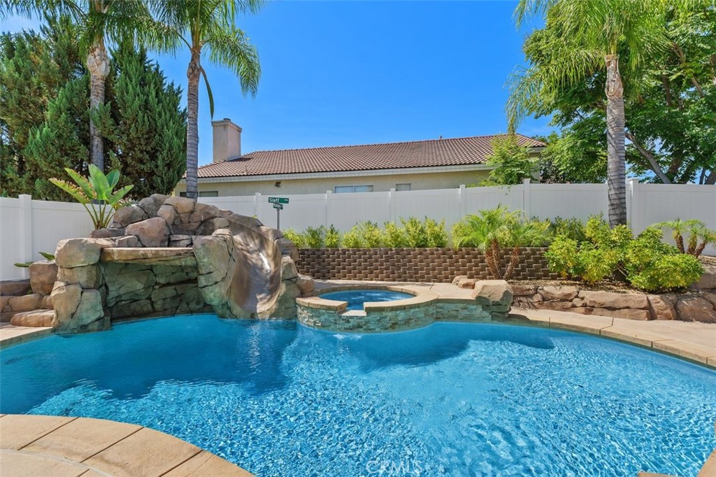 Resort-Style Living right here in Temecula!
POOL with Waterfall - SPA - Paid Solar - RV Parking - No HOA - Downstairs Bedroom & Bath - New Heating System, with SMART Thermostat - New AC - New Pool Heater - Water Softener – Plantation Shutters. Situated on a beautifully well- maintained street, this stunning two-story residence features 4 spacious bedrooms, 3 upgraded bathrooms, & a backyard oasis designed for relaxation & entertaining. Fall in love with the Grand entry with soaring ceilings & elegant Porcelain Italian tile Aequa Tur 8x32 non-slip flooring. The Formal living and dining areas are filled with natural light & the Gourmet kitchen features granite countertops, tile backsplash, Stainless Steel appliances & Kraft Maid cabinetry. The Cozy family room has a fireplace & sliding glass doors opening to the fabulous backyard. A Downstairs bedroom & remodeled bath are ideal for guests or multi-generational living with a walk-in shower, new vanity, & upgraded flooring. The Laundry room has direct access to the 2-car garage & is equipped with ample storage & a water softener system. The Luxurious primary suite with Italian flooring, dual walk-in mirrored wardrobes, & a fully upgraded en-suite bathroom will make you feel like you are in an expensive Boutique Hotel! There are two additional bedrooms with the Italian tile flooring & a second remodeled bathroom to complete this package. The Sparkling Pebble Tech pool & spa with a tranquil waterfall adds to this oasis, plus a Covered Custom patio with Aluma-wood shade structure makes entertaining a dream. The crown jewel is the RV parking for RV vehicles up to 45 ft. long & the Paid-off solar system is perfect for energy efficiency. And the additional perks: Low Tax Rage, Close to shopping, Pechanga Resort Casino, with easy access to the 15 Freeway and Zoned for the highly acclaimed & award -winning Great Oak High School. This home truly captures the essence of Temecula living at its finest & we welcome your consideration of ownership in this Amazing Property.