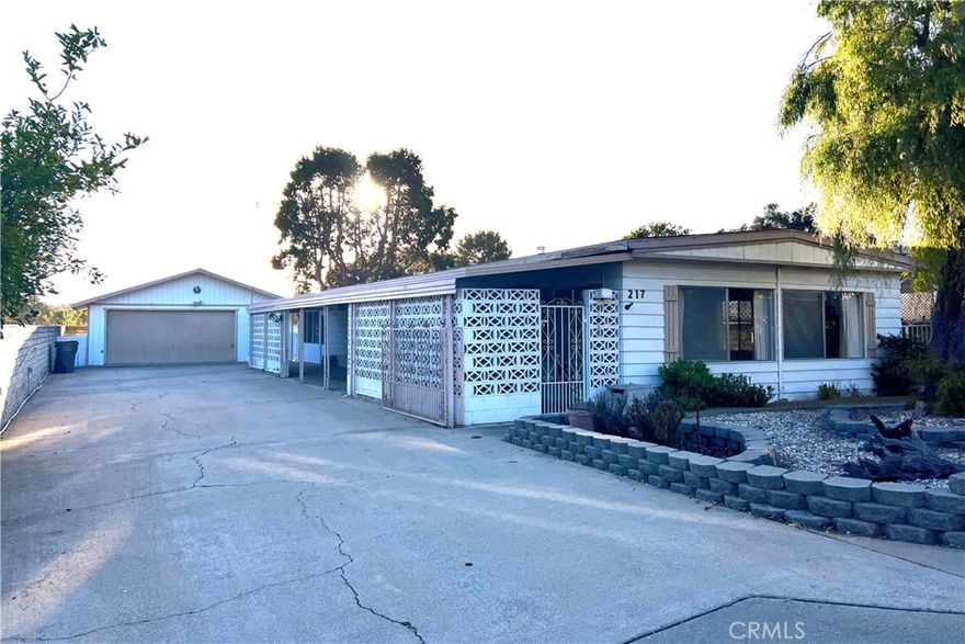 Own the land with no HOA or space rent! This affordable 2-bedroom, 2-bath manufactured home in desirable Nipomo offers incredible potential on a spacious 7,620 sq ft lot. Features include a cozy family room with fireplace, covered patio perfect for entertaining, and a detached 2-car garage with workshop space. Located in a quiet, established neighborhood in a convenient location. Whether you're looking to update, remodel, or simply move in and enjoy Central Coast living at an attractive price point, this property offers endless possibilities.