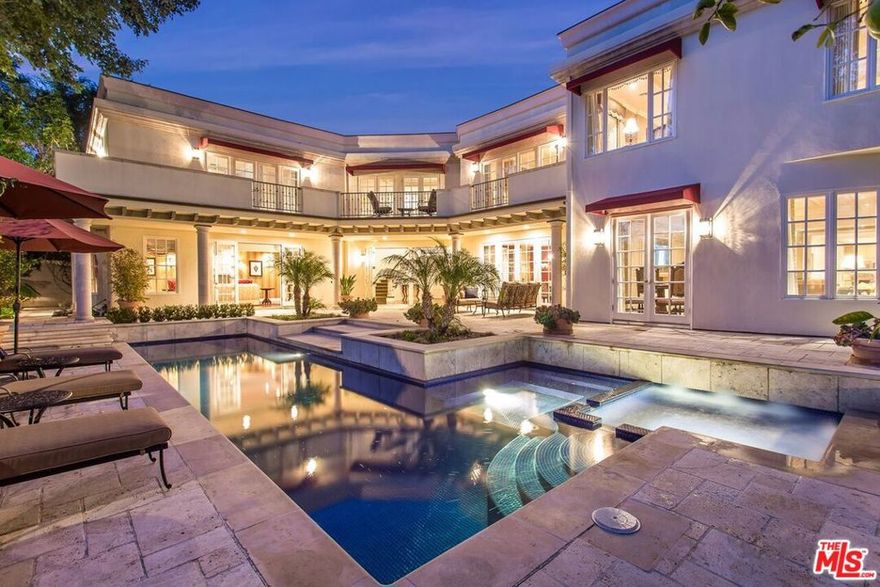 This Villa style 5 bed /7.5 bath home has it all! Wonderful curb appeal w/traditional details in every roomhard wood floors, built-ins, crown molding, 5 fireplaces, designer lighting & custom window coverings throughout. The dramatic 2-story entry opens to 8,300 sq. ft. of luxury in a spacious floor plan w/large scale rooms and French doors opening to pool/spa and tranquil canyon views. The hub of the house is a large family room adjacent to the breakfast area and gourmet kitchen with top of the line appliances. The grand staircase leads to a 2,200 sq. ft. master suite offering, sitting area, fpl, wet bar, dual baths and walk-in closets. The large picture window in master suite offers fabulous canyon views. All bedrooms are en suite - 3 additional up & a maid's down - plus a powder & ¾ bath on the first floor. Exterior patios w/stonework, landscape lighting, pool/spa; patio off kitchen w/BBQ area is perfect for al fresco dining - ideal for entertaining, yet low-maintenance.