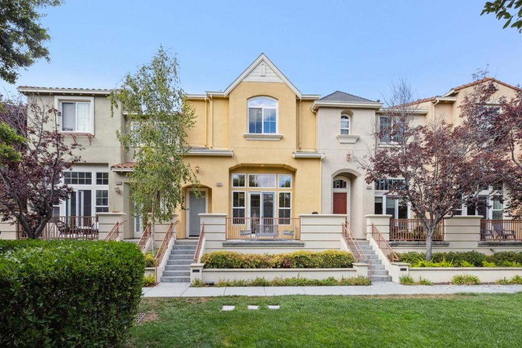 A beautiful Marina-style townhome in a rare setting adjacent to the greenbelt, offering lush views and the perfect space to enjoy the outdoors. Just minutes from Rivermark Village, Live Oak Park, Don Callejon School, the community pool, and the library, this home provides both convenience and community. The inviting living room features high ceilings and a cozy fireplace with serene views of the patio and greenery, creating an ideal place to relax or entertain. The spacious kitchen opens to the dining area and looks out onto the greenbelt, providing a seamless connection between cooking, dining, and nature. It offers abundant countertop and cabinet space, modern appliances, a water purifier, and a Kraus sink with accessories to enhance your culinary experience. The primary suite overlooks the greenbelt and includes a spa-like soaking tub and a walk-in closet with a built-in organization system. Two additional bedrooms feature top-down, bottom-up shades for comfort and privacy. Upper level also offers a laundry room with cabinets and a hallway linen closet. New luxury vinyl flooring offers a modern look that is easy to maintain. This home is completed by a private patio, a side-by-side garage, and bonus crawl space storage. Its a perfect blend of location, lifestyle, and comfort.