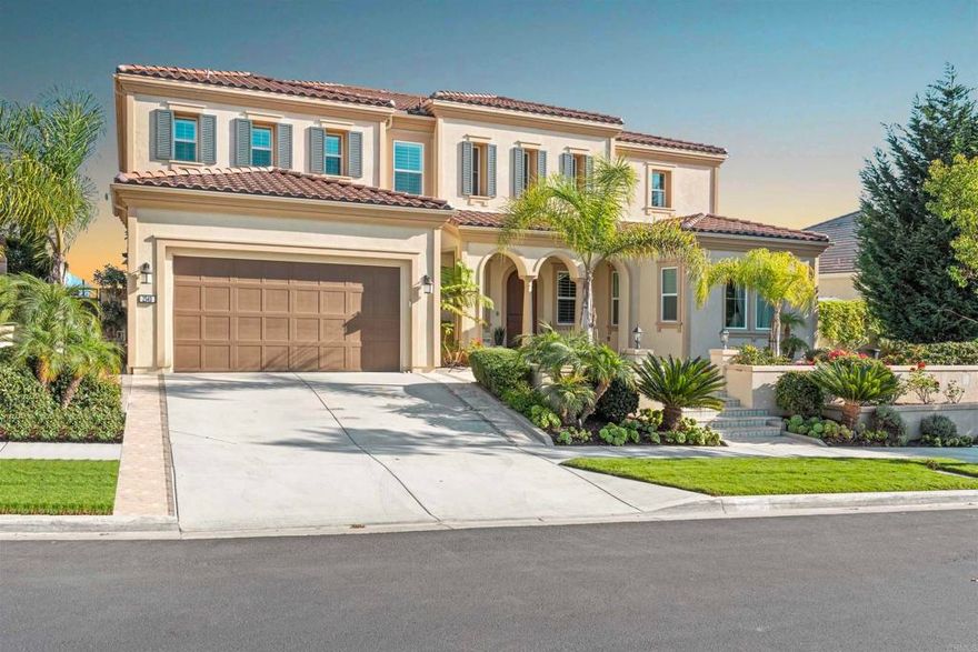Discover refined living in this exquisite 6-bedroom estate, tucked within the exclusive gated community of Robertson Ranch. Blending sophistication and comfort, this residence showcases soaring ceilings, impeccable architectural details, and exquisite designer finishes throughout. Step inside to find an elegant mix of Carrara Gioia marble, Jurastone Beige tile, and rich hardwood flooring, creating a seamless flow of luxury and warmth. The chef’s kitchen serves as the heart of the home, featuring premium finishes and thoughtful craftsmanship ideal for both entertaining and everyday living. Just off the kitchen, the family room’s glass doors invite natural light and open to the backyard, offering an effortless connection to the outdoors. The primary suite, conveniently located on the first floor, offers a serene retreat of comfort and style. Dual laundry rooms on each level add exceptional convenience. Step outside to your own private retreat—where serene bluff views frame the luxury pergola, built-in BBQ and a breathtaking custom fountain that anchors the expansive patio. The home is also equipped with solar for modern efficiency and ease. Enjoy resort-style community amenities, including a sparkling pool and spa, elegant clubhouse, beautifully maintained parks, and more. Perfectly positioned just 3 miles from the beach, with access to top-rated schools and nearby shopping and dining, this extraordinary property embodies the very best of Carlsbad luxury living.