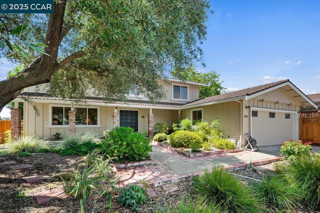 New Listing! Located in desirable Walnut Creek, one of Bay Area’s most desirable communities, you will find this charming two-story home that combines ease of living with enchanting gardens plus expansive views. Dramatic entry w/ high ceilings & clear-story windows leads to the spacious Living Room & Dining Room overlooking picturesque yard w/ gleaming hardwood floors. A wonderful country kitchen offers wood cabinetry, Corian counters & spacious breakfast nook. The sliding glass door leads to park-like yard w/ sweeping views of the valley & incredible sunsets. The Family Room is great for family time w/ fireplace & beam ceilings & sliding door that leads to wood deck & picturesque garden. Primary bedroom is spacious w/ hardwood floors, dual closets, views overlooking yard & hills. The primary bathroom offers double sink & shower. The additional 3 bedrooms are light & bright w/ hardwood floors & offering views of yard & hillside. Located in desirable “Woodlands” neighborhood this charming home features a tranquil & picturesque setting w/ fabulous garden w/ roses, pathways, decorative plants in every corner. Beautiful views throughout the yard plus a path that leads to a very large lower area w/ fruit trees & bushes, or you can use your imagination to create your own paradise.