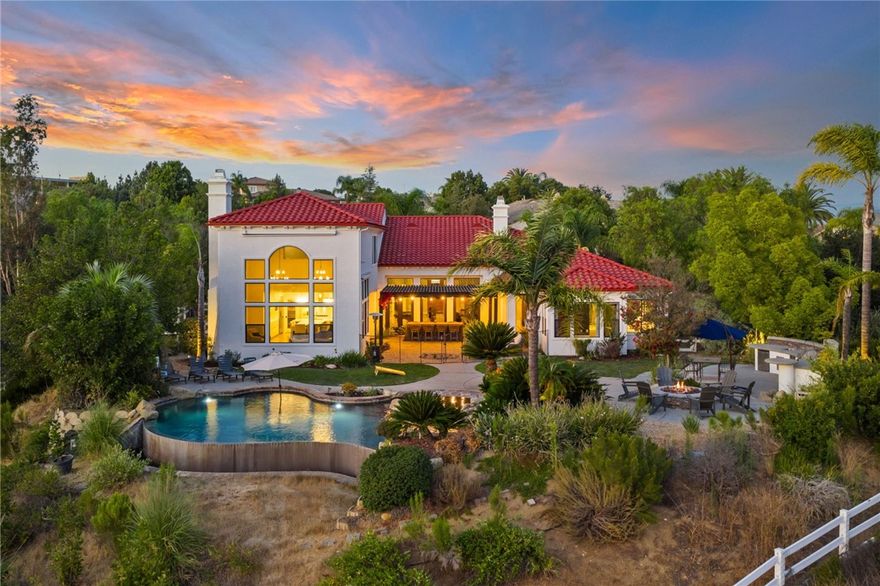 Panoramic Sunset Views | Infinity Edge Pool & Spa | 4 Beds + an Office | ALL Bedrooms with En-Suite Bathrooms + So much more... Discover a rare opportunity in one of Temecula’s most coveted neighborhoods. Tucked at the very end of an exclusive four home cul-de-sac, this beautifully remodeled estate captures some of the most breathtaking sunset vistas the valley has to offer. Privacy, space, and views combine to create a setting that’s simply unmatched. Designed for single story living, the main level features a spacious primary suite with its own sitting area and private office/lounge, plus two additional bedrooms each with en-suite baths and an oversized office that can easily serve as a fifth bedroom if desired. The primary suite overlooks incredible sunsets and includes a large walk-in closet and separate retreat space. Upstairs you’ll find a generous bonus loft with dramatic picture windows framing the panoramic views, along with a private guest bedroom and full bath. Set on 1.26 fully usable acres, the property is fully fenced with a private wrought iron entry gate and offers endless potential. Imagine adding an RV garage, pickleball court, or custom outdoor retreat the space is ready for your vision. Existing RV amenities include dedicated parking with 220 volt electrical, sewer clean-out, and full hookups. A four car garage with sleek epoxy flooring provides ample storage and workspace. This home has undergone a thoughtful, high end remodel: new luxury vinyl plank flooring flows throughout, the kitchen has been completely redesigned with modern finishes, bathrooms shine with stylish upgrades, and fresh interior and exterior paint makes the entire residence feel brand-new. Every detail is move in ready. Adding to the allure, the property sits in the perfect location for 4th of July fireworks, launched directly across the street near the Temecula Library enjoy the show from the comfort of your own backyard. Low taxes and no HOA mean more freedom and lower carrying costs. If you’ve been seeking a truly special Temecula property one that blends privacy, elegance, and incredible views this home delivers it all. From sunrise coffee on the patio to wine-country evenings watching the sky turn gold and crimson, every moment here feels extraordinary.