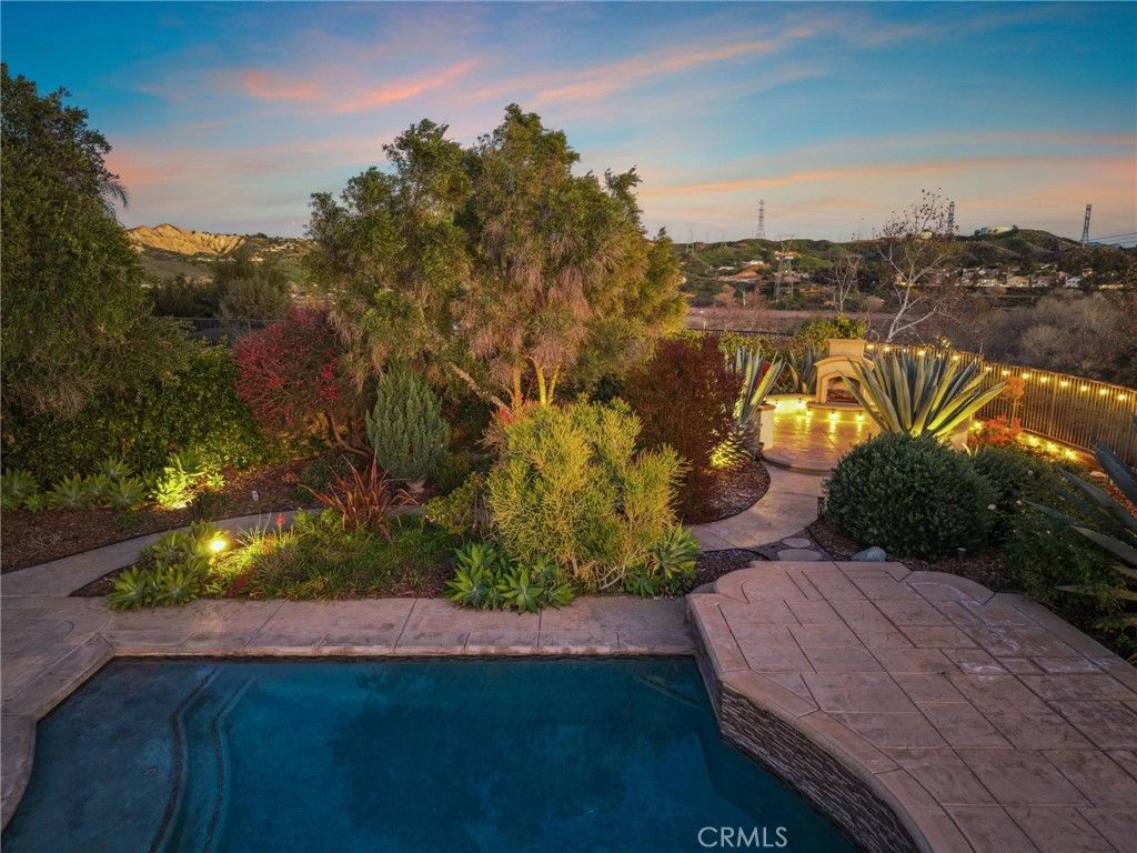 Photo of 29158 Mission Trail Ln, Valencia, CA 91354 (MLS # SR26011281)