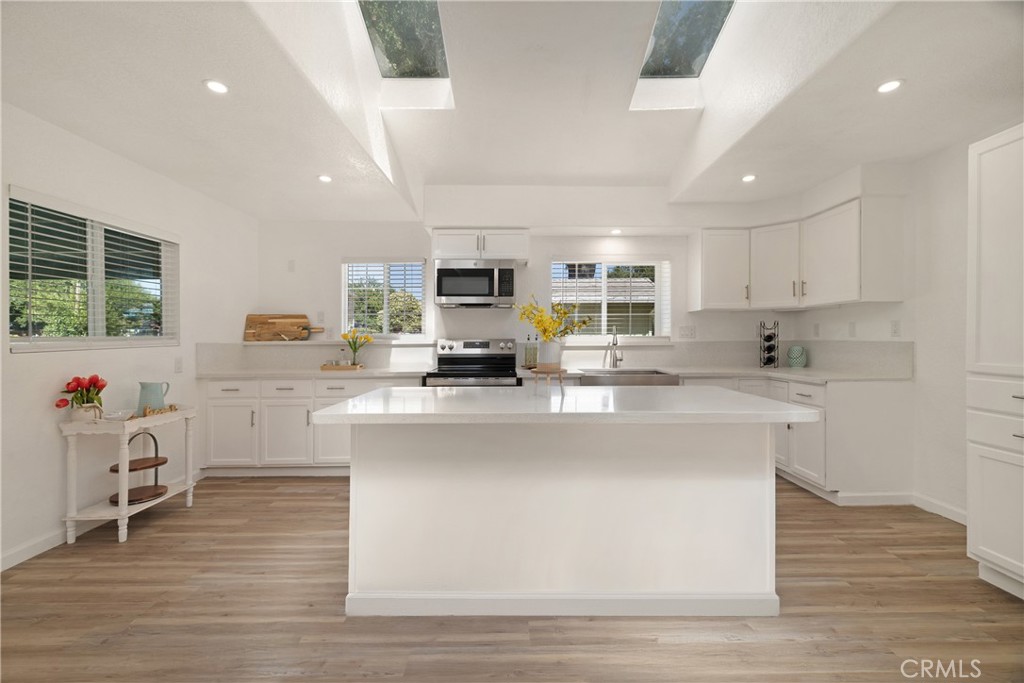 VA! FHA! USDA! This beautiful newly remodeled home features tons of natural light, recessed lighting, tankless water heater, vaulted ceilings, skylights, quartz counters, large center island, farmhouse stainless steel sink and new stainless steel appliances. The bathroom offers quartz vanity top, designer sink & faucet and floor to ceiling quartz shower walls. The yard is over half an acre and has a 2 car carport, open courtyard with lights, built-in planter boxes full of plants & flowers and a custom built picnic table. There is also a lovely gazebo with curtains on the property and a foundation, ready to build your new shop or ADU. There's 2 separate driveway entrances, making it convenient to park all of your toys. Additionally, there are gutter guards, ring cameras, security lights, Starlink High Speed Internet, AND 3 rv hookups on the property, in case extra company arrives for a visit. Complete, with the fully fenced yard located in a court, apricot tree, grapevines and small door for your cat or chihuahua, you won't want to let this property pass you by!