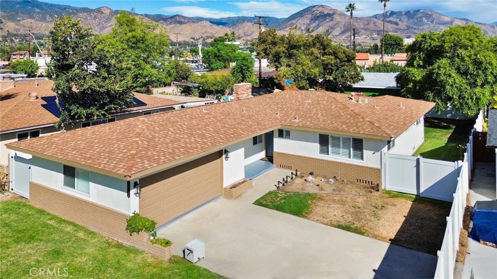 Welcome to 3025 N Alameda Avenue, a beautiful MOVE-IN ready home for your family to enjoy! This home offers 3 bedrooms, 2 baths, on 1,883 sqft of comfortable living space. An upgraded modern kitchen with quartz countertops, wood cabinets, recessed lighting, and a large kitchen island that offers ample cabinet space and dining area. Kitchen is open to family and rec room for more family gatherings and conversations to appreciate. There is a big bonus/rec room (could also be used as office space) that offers access to the patio area. In the back area there is a stamped concrete patio area and plenty of space for parties and BBQ times.  Upgrades include window wood shutters, recessed lighting, laminate flooring, dual-pane windows, vinyl fencing for more privacy and more. 2-car garage with an oversized driveway for ample parking.