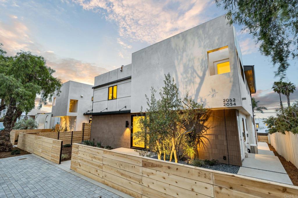 Stunning new construction in Cardiff’s iconic Walking District! 2052 Montgomery Ave blends sophisticated coastal style with spacious modern living and panoramic ocean views. This thoughtfully designed 4 bedroom, 3 bathroom, 2553 SF home showcases refined architectural details and top-tier craftsmanship throughout. Glass doors open to a spacious view deck, while a private rooftop deck elevates the experience with even more spectacular coastal panoramas. At the heart of the home is a chef’s kitchen that blends style and function with striking natural stone countertops, custom wood cabinetry, built-in panel appliances, and a massive island with bar seating. The wide-open layout flows seamlessly into the dining area and living room, creating a light-filled, contemporary space with clean lines, warm finishes, and plenty of room to entertain. A beautifully appointed 2 bedroom, 1 bath detached, 1091 SF ADU adds flexibility—ideal for extended family, guests, rental income, or a private work-from-home space. The ADU also features its own expansive outdoor rooftop deck, creating an elevated sense of independence and comfort. With a finished 2-car garage, drought-tolerant landscaping, and exceptional attention to detail throughout, every inch of this property reflects quality craftsmanship and thoughtful design. Located just blocks from Cardiff’s charming town center, you’re minutes from Seaside Market, gourmet dining, boutique shopping, and some of North County’s best beaches and surf breaks. Whether you're grabbing morning coffee, biking the coast, or watching the sun dip into the Pacific, this home places you at the center of it all. A rare opportunity to own a brand-new, ocean-view property in one of San Diego’s most sought-after coastal communities.