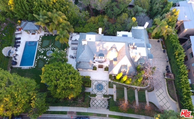 North Alpine is celebrity and billionaire row for a reason. A very rare north of Sunset cul-de-sac location that provides privacy, very limited traffic, huge lots and homes. This home is no exception: a spectacular lot, magnificent home and fabulous location in what is one of the best blocks north of Sunset Blvd. This French country estate features over 11,000 square feet of perfection. Renovated to precise standards, this property is the perfect family home for the most sophisticated buyer. Details include a warm wood paneled library, hand crafted parquet floors throughout and only the finest rare French finishes. Designed for entertaining on a grand scale the Alpine estate offers a screening room, billiards room, wine cellar with wine tasting room and an onyx bar. Grand public rooms all open through French doors to the manicured formal gardens, pool and verdant grounds. A truly rare opportunity to live in the most exclusive and coveted area in Beverly Hills on a huge lot.