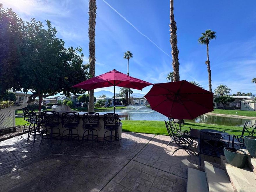 Located in the beautiful Desert Aire resort. Desert Aire is an over 55, pet free, 9 month park. Desert Aire does not permit full time residency. This park is primarily used by snow birds looking to spend the winters in our warmer climate.Take a look at this outstanding 2015 park model with a loft, located on one of the best lots in the park. This park model has everything!! Starting with the location, you have mountain views as well as being located on the water. You will enjoy entertaining on the large patio complete with an outdoor kitchen. You have a large bar with lots of seating, built in BBQ, side burner, built in refrigerator and stereo system. Two large umbrellas provide shade, but you will enjoy all the sunshine this space provides. Spend time sitting around the propane fire pit with your friends on the cool winter evenings.There is a large custom built storage shed that will hold all of the patio chairs and cushions and umbrellas.Stepping into the beautiful park model, you will find it tastefully decorated with all of the furnishings included in the sale. There are two flat screen televisions, lots of storage throughout the unit. There is a built in clothes dresser inside the closet of the bedroom. The large loft adds additional square footage and is perfect for an upstairs office or additional sleeping for those special grandchildren that will want to visit!!There are so many features to mention, you just need to see this beautiful property.This park model is move in ready and has everything you need to start enjoying your time in Desert Aire!!!