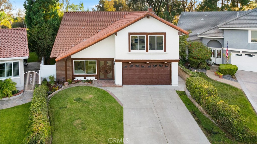 Welcome to your dream home in Mission Viejo! This fully renovated 4-bedroom, 3-bathroom residence offers nearly 2,600 sq. ft. of modern luxury and timeless design. Step inside through the grand double-door entry to an open floorplan with soaring cathedral ceilings, brand-new luxury vinyl flooring, and abundant natural light.
The heart of the home is the chef’s kitchen featuring white and white oak custom cabinetry, oversized quartz island, and top-of-the-line LG stainless steel appliances. The kitchen flows seamlessly into the family room and formal dining room, perfect for entertaining. A custom-built white oak bar with wine fridge and floating shelves adds a stylish touch.
Retreat to the spacious primary suite with a beautifully remodeled en-suite bathroom, while the large secondary bedrooms offer comfort and flexibility. All bathrooms feature stunning quartz counters, designer cabinetry, and modern finishes.
Enjoy year-round outdoor living in your private backyard oasis with a newly remodeled pool, brand-new pool equipment, custom awning, rebuilt expansive deck overlooking peaceful woodland views, brand-new white vinyl fence, new sod and landscaping, and all-new concrete with upgraded drainage.
Additional highlights include: new exterior and interior paint, brand-new energy-efficient windows, recessed lighting with elegant chandeliers, custom floor-to-ceiling fireplace with electric fireplace and TV nook, brand-new AC system, finished garage with epoxy flooring, and so much more.
This home combines high-end upgrades with exceptional functionality—move-in ready and perfect for both entertaining and everyday living.