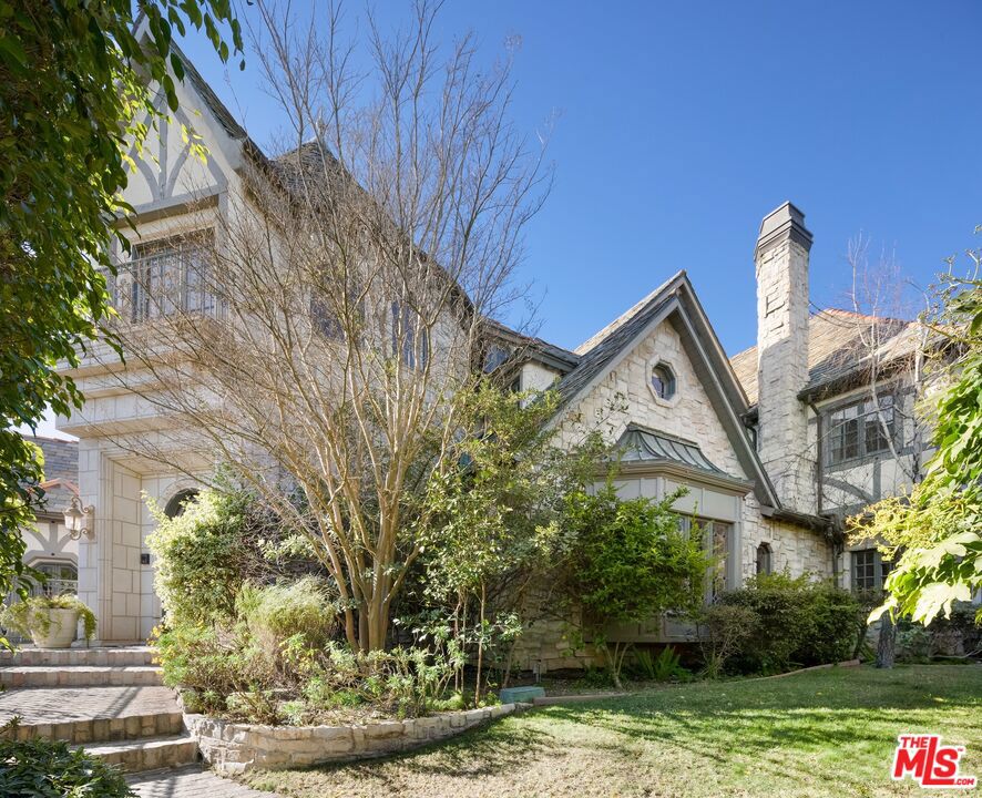 Perched atop a significant vantage point in Bel Air, this enchanted French Castle style estate boasts grand aesthetics, sweeping views over West Los Angeles, and a spacious flow which absorbs large parties of family and friends effortlessly.Entering the home, a spiral staircase and cathedral-like ceiling frames a grand hallway, which unfolds into multiple living rooms, a massive kitchen and world class views. Descending the hillside property into the outdoor area, one finds a gazebo overlooking the Getty Center, a stunning pool, a long cobblestone driveway and a spacious 1,500 square foot guest house with a loft, a kitchen, high ceilings and ample natural light. Bedrooms are spacious, warm, and feature en suite bathrooms and ample closet space. Primary suite features best-in-class views and a unique loft perfect for a home office or workout area. Excellent layout with thoughtful use of square footage. This estate executes flawlessly on its countryside aesthetic and fills all who enter with a nostalgic sense of joy and wonder. Minimum 13-month lease term.