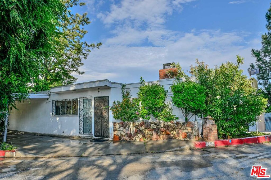 Opportunity awaits at 2536 Vasanta Way, your chance to secure a valuable property in the coveted Beachwood Canyon neighborhood with Canyon and City views galore! This cozy fixer-upper offers 2 bedrooms and 2 baths, providing the perfect opportunity to turn it into the house of your dreams. The hillside lot offers privacy, canyon breezes, and serene treetop views. Both bedrooms and an open concept living room lead out to a spacious deck and balcony and these incredible views! Whether you're looking to renovate, restore, or reimagine, this tranquil oasis sits in a neighborhood known for its eclectic character and close proximity to scenic hiking trails, Beachwood Cafe, Franklin Village, Lake Hollywood and the studios. This is a rare opportunity to create your ideal home in one of LA's most iconic hillside communities.