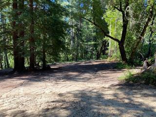 An unusual opportunity to have beautiful acreage right off the pavement. Assessors records show a cabin on the property that is no long there. Over eight and a half acres right on Bear Creek road only 3.5 miles from Boulder Creek. Featuring beautiful creek frontage below, with substantial flat open areas in sunshine and shade. Ancient logging road on the property runs parallel to bear creek road descending towards the creek. Many redwoods, madrone fir and oak. Barely a mile from Bear Creek Estates and the swim and tennis park. 20 minutes to hwy. 17 Build your dream home or Family compound ranch, close to everything.