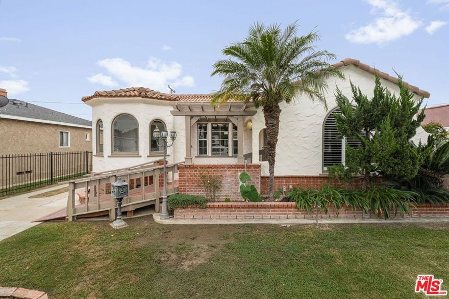 A historic opportunity to purchase a home in one Los Angeles' growing areas: First time on the market in over 30 years, this beautiful home has been impeccably cared for and updated with uncompromising integrity, awaiting its next generation of owners. This 2-bed, 1-bath Spanish blends old-world charm with thoughtful, modern updates. Showcasing the distinctive elements of Spanish architecture, such as the iconic red clay tile roofing and smooth stucco exterior, this residence embodies both timeless beauty and lasting design, while celebrating exquisite attention to detail and orientation. The timeless splendor with contemporary twist can be the perfect space for entertaining, for a family of all ages. From the moment you step inside you are greeted by arched ceilings and a stately fireplace that complements the home's grandeur. Then, the formal dining area flows seemingly into the freshly painted kitchen which leads to a breakfast nook with original cabinetry; a perfect setting for your first sip of coffee in the morning. Both bedrooms have been recently updated with fresh paint and floors and the spacious bathroom boosts built in cabinetry; the perfect balance between old world charm and modern comfort as many original doorknobs are still in place. A spacious laundry area available for your splendor leads you to the side door and transports you to the newly re-designed backyard which serves as private oasis, featuring drought resistant verdant landscaping and DG pathways quintessential for al fresco dining while basking in the California sunshine. The front yard features lush palm trees and manicured hedges which creates a tranquil, tropical ambiance. A rare opportunity to be the next steward of this lovingly cared for home.