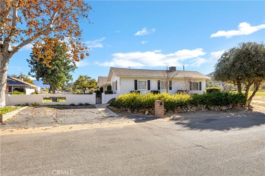 Meticulously maintained by the original owner, this well-built custom home offers three bedrooms and two bathrooms, showcasing timeless craftsmanship and thoughtful design throughout. Newer windows enhance energy efficiency, while the formal living and dining rooms feature vaulted ceilings, built-in bookshelves, and a welcoming fireplace—perfect for both everyday living and elegant entertaining.
The open-concept kitchen and family room are filled with natural light and designed for connection and comfort. The kitchen offers a breakfast bar, double oven, gas cooktop, dishwasher, informal dining area, and beautiful views of the covered patio and enclosed grassy yard. Large windows frame picturesque mountain views, creating an ideal setting to enjoy morning coffee or an evening beverage while watching breathtaking sunsets.
The spacious family room flows seamlessly to an additional patio, providing an inviting space for gatherings with family and friends. The private primary suite features two closets, a Hogan-style fireplace, ceiling fan, wood flooring, and direct access to the exterior. The primary bathroom includes a combination tub and shower with newer countertops.
Two additional bedrooms are generously sized and thoughtfully positioned for privacy. The updated guest bathroom features a walk-in shower, and window coverings are installed throughout the home.
Outdoors, the pool area is separately fenced for safety and privacy. A detached two-car garage with an additional bathroom adds convenience and flexibility. Situated on over an acre of land, this exceptional property offers ample space for RVs, recreational toys, or future possibilities—making it the perfect place to turn your dream into reality.