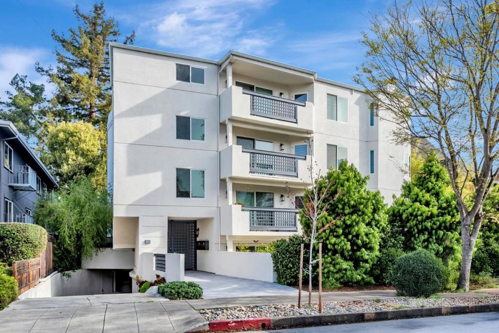 Exquisite Newly Renovated Luxury Condo in the Heart of Burlingame. Immerse yourself in the charm of boutique shopping, gourmet dining, and a lively community atmosphere steps from your front door. This residence is designed for comfort and style, with high-end finishes and thoughtful upgrades. Double-pane windows adorned with beautiful custom treatments flood the space with natural light while ensuring peace and privacy. Step into the expansive living room with many windows to bring light into your home, and a cozy fireplace creates an inviting ambiance. The spacious eat-in kitchen boasts granite countertops, premium cabinetry, a breakfast bar, and ample storage. The luxurious primary suite is a true retreat, offering abundant light, dual sinks, an oversized jet tub, and a private stall shower. The second bedroom extends to an enclosed tiled balcony, accessible from both the bedroom and kitchen. Secure, gated parking includes two parking spaces and two large storage units. Located in a top-rated school district with award-winning schools. Prime location offers easy access to Highway 101, and Caltrain, making commuting a breeze. Embrace the best of Burlingame living in this move-in-ready, upscale residence where luxury meets convenience in an unbeatable location.