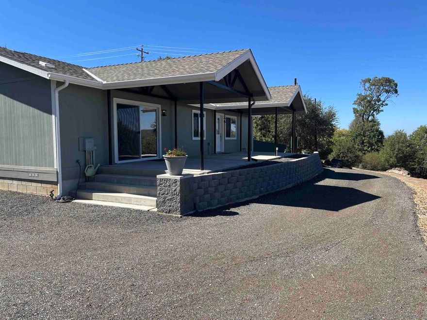 Beautiful Mountain Views from a Turnkey Home  Enjoy breathtaking mountain views from this turnkey, move-in ready home, perfectly situated on a 1.25-acre lot featuring a mix of level areas ideal for boat or RV parking and a well-maintained grove of mature oak trees.  The exterior has been thoughtfully designed for easy maintenance, from the cleared brush to the manicured landscaping. Whether you’re looking for a full-time residence or a vacation getaway, this property offers flexibility and comfort.  While technically a manufactured home, it does not look or feel like one. The fully remodeled interior boasts modern upgrades throughout, including quartz countertops, a spacious shower with dual shower heads, and high-end ceiling fans in every room.  This exceptional property is a must-see — combining comfort, style, and serene natural surroundings.