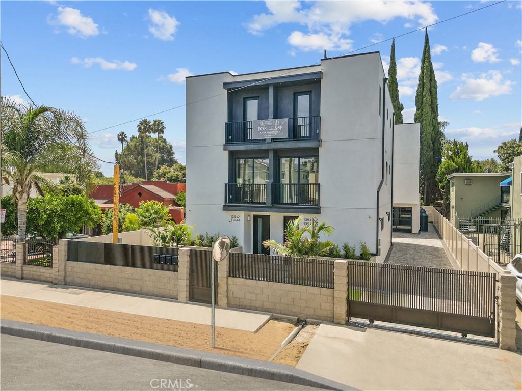Welcome to 13942 Vanowen St. This new front unit combines modern design with practical use in the heart of Van Nuys. This spacious unit has three bedrooms and three full bathrooms, laid out in an open design. It offers a total of 1,942 sq ft, which includes a private garage and laundry area, with approximately 1,425 sq ft of comfortable living space. On the main level, there is an open living room with a balcony, one bedroom, and a full bathroom. This space is great for guests or a home office. Upstairs, you will find two bedrooms, each with its own bathroom, providing comfort and privacy. The primary suite also has a private balcony. A second balcony off the living room creates a smooth flow between indoor and outdoor spaces, perfect for relaxing or entertaining. This home features quality finishes, plenty of natural light, and direct access to the garage. It is ideal for those looking for comfort, convenience, and style. Located just minutes from Valley Glen, major freeways, and local amenities, this is a great chance to own a modern home in a sought-after San Fernando Valley neighborhood.