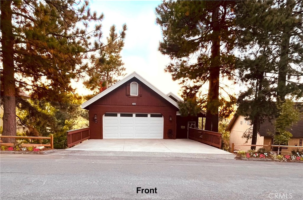 Stunning mountain retreat nestled at the edge of the San Bernardino Mountains and forest. Step through a beautiful oak front door into a spacious, open-concept living room featuring vaulted ceilings and a grand rock fireplace. Enjoy the full mountain experience with breathtaking panoramic views of the forest, vibrant sunsets, and frequent wildlife sightings—all visible from the expansive rear deck and the primary bedroom. Don’t be surprised to see deer strolling through the neighborhood.
The oversized kitchen, complete with a breakfast bar and adjacent dining area, makes entertaining a delight. Downstairs, you’ll find three additional bedrooms, a laundry closet, a wet bar, and a large game room or optional fourth bedroom—also featuring a large rock fireplace.
The luxurious primary suite includes its own private deck overlooking the forest, a soaking tub, and a walk-in shower. Below, a massive unfinished lower level offers potential for additional living space, a workshop, or custom expansion.
Additional features include ceiling fans throughout, central heat and A/C, plus an unvented A/C unit in the upstairs living room. The spacious 2-car attached garage may be entered through a door between the living room and kitchen. The home is also equipped with surround sound speakers in both the living room and primary bedroom.
Located in the desirable Arrowhead Woods community, this home grants you exclusive access to the pristine, private waters of Lake Arrowhead.