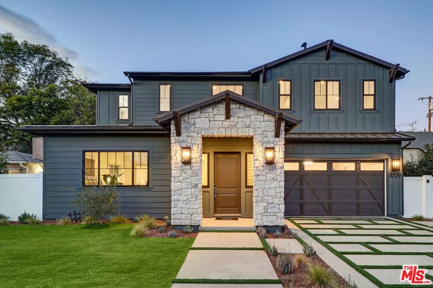 This stunning new construction farmhouse-style home by TJH perfectly blends modern luxury with timeless charm in the heart of Valley Village. Nestled on a peaceful, tree-lined street, this 4-bedroom, 4.5-bath residence offers an inviting open floor plan designed for effortless entertaining and everyday comfort. The spacious living and dining areas flow seamlessly into a gourmet kitchen featuring Wolf and Sub-Zero appliances, a walk-in pantry, and a stylish butler's pantry. A first-floor bedroom with an ensuite bath and walk-in closet is ideal for guests or a home office. Upstairs, discover a versatile loft, two secondary bedrooms with walk-in closets, and a convenient laundry room. The grand suite is a true retreat with a generous walk-in closet and spa-inspired bath showcasing dual vanities, a freestanding soaking tub, and a walk-in shower. Step outside to your private backyard oasis with a sparkling in-ground pool and spa, perfect for relaxing or entertaining under the California sun. When you purchase this stunning new home, you'll also receive a three-year lease of a brand-new Tesla Model 3 or Model Y - a perfect blend of luxury living and modern sustainability. Drive into your new life with style, comfort, and zero emissions from day one. Your dream home now comes with the ultimate electric driving experience included. New TJH homeowners also receive a complimentary one-year Inspirato membership for exclusive luxury travel experiences.