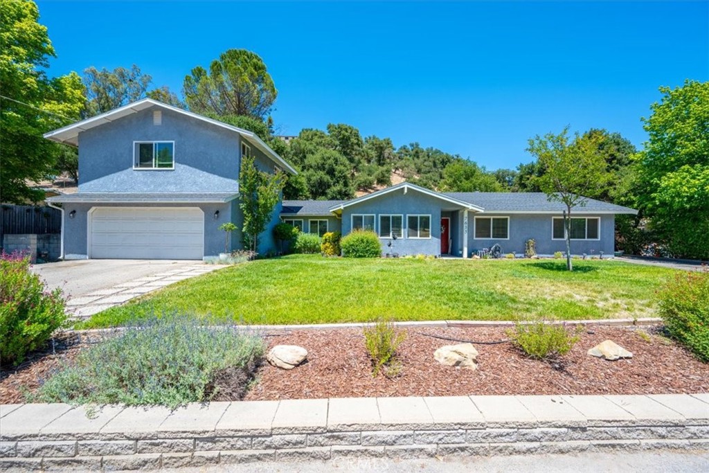 Welcome Home to Space, Comfort & Family Fun! Tucked away in a quiet neighborhood just minutes from downtown and top-rated schools, this well-loved 4-bedroom, 3-bathroom home sits on nearly half an acre and offers 2,253 square feet of updated living space designed with family in mind. From the moment you arrive, you’ll notice the abundance of parking — two driveways, street parking out front, and a spacious garage with an attached ~150 sf workshop, perfect for hobbies, storage, or extra gear. Inside, recent updates give the home a fresh and functional feel: new SPC flooring on the main level, new baseboards, upgraded double-pane windows, and a fully remodeled kitchen with sleek stainless steel appliances, new light fixtures, and modern finishes. This home is built for connection and flexibility, offering two living rooms including a cozy second living space with a wood-burning fireplace — perfect for movie nights or a quiet place to unwind. Upstairs, you’ll find a large bonus room with its own bathroom above the garage that could easily serve as a home office, guest suite, or teen hangout. The private backyard is a dream come true for families and entertainers alike. Whether it’s soaking in the hot tub under the stars, tending to your chickens in the darling coop, gathering farm-fresh eggs, gardening, or watching the kids run wild in the open space, there’s something here for everyone. The front yard has also been freshly landscaped, adding great curb appeal. With thoughtful upgrades like a new heater and A/C system, new door hardware, and plenty of storage throughout, this home checks all the boxes. Whether you’re hosting a gathering or just enjoying a sunny afternoon in your own backyard, it’s clear this property was made for living well. Don’t miss your chance to see it in person — homes like this don’t come around often! The existing FHA loan is assumable at 4.375%! A second may be available through existing lender.