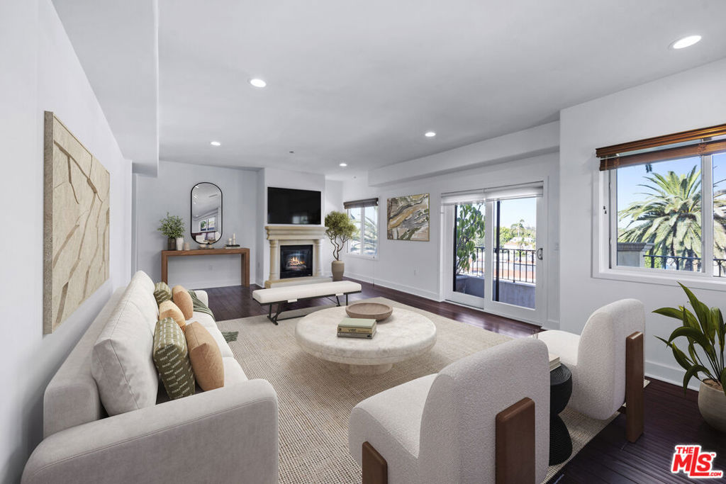 Discover Villa Fiorita, a sophisticated residence perfectly situated in a prime Beverly Hills location, offering the ultimate blend of luxury, convenience, and city living. Just minutes from some of L.A.'s most coveted shops, acclaimed restaurants, beautiful parks, and cultural landmarks. This 3-bedroom, 2.5-bath front-unit condo is designed for both elegance and comfort. Inside, you'll find custom finishes and high-end details throughout: granite countertops, European-style cabinetry, travertine baths, recessed lighting, double-pane windows, and rich hardwood floors. A thoughtful floor plan adapts to any lifestyle, featuring a formal dining room and breakfast nook, a spacious primary suite with walk-in closet, and the choice of a soaking tub or walk-in shower. The expansive living room, anchored by an elegant fireplace, flows seamlessly to a large balcony with sweeping views of the Hollywood Hills, perfect for morning coffee or evening cocktails. For a more intimate retreat, enjoy a private bedroom balcony. From your doorstep, explore world-class destinations: The Beverly Center, The Grove, Restaurant Row, the trendy cafes of 3rd Street, LACMA, and Hancock Park. Trader Joe's, Cedars-Sinai Medical Center, and the SLS Hotel are just blocks away, placing everyday convenience at your fingertips. Additional amenities include in-unit washer and dryer, a well equipped fitness center, three side-by-side indoor parking spaces, electric vehicle charging stations, and an extra storage room. Wake up in the heart of Los Angeles with the prestige of a Beverly Hills zip code. Villa Fiorita offers the very best of both worlds!