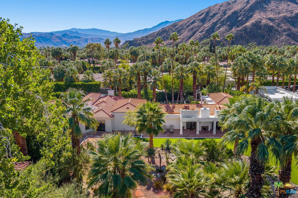 Running Water. A Rare Find. A True Sanctuary. A perfect blend of privacy, serenity and contemporary design, Running Water is a meticulously remodeled two-home estate formerly owned by the famed author, Sidney Sheldon. Located in the charming Old Las Palmas neighborhood of Palm Springs, the 1.17 acre property now features a formal gatehouse, custom designed gates, fabulous desert gardens and flowering trees, two swimming pools (social and 75-foot lap), state-of-the-art amenities and spectacular views of the San Jacinto Mountains. Originally built in 1948, the 7,783 square-foot residences have been remodeled in a contemporary Mediterranean style by the current owners. Covered patios facilitate an indoor/outdoor lifestyle. The 5,797 square-foot main house was completely reconfigured to connect the social areas while maintaining the seclusion of the private quarters. The resulting split layout is private yet inviting, with well-proportioned rooms, ceilings of up to 11 feet, and four fireplaces. This home offers: spacious and warm living quarters with sitting room, music room, and formal dining room. Designer chef's kitchen featuring Bulthaup cabinetry and Gaggenau appliances. Screening room perfect for watch parties or a quiet movie night at home. Office with built-in bookshelves and desk. Four bedrooms with ensuite bathrooms featuring contemporary Boffi cabinetry and designer fixtures. Two additional powder rooms, thoughtfully distributed through the home. Large windows that capture breathtaking mountain views and abundant natural light and a Three-car garage. The guest house thoughtfully connected to the main home by stunning gardens is a one-bedroom 1,986 square-foot home with a separate address. This home was re-conceived by the current owners to provide for guest accommodations. Maximizing mountain views, this home features dining and living rooms, and a primary bedroom with walk-in closet and ensuite bathroom. Gaggenau appliances, Bulthaup and Boffi cabinetry and clean lines provide a feel similar to the main home. The guesthouse additionally includes an apartment/studio with separate entrance. This space has a private bath and is ideal for a yoga room, studio space, gym, art studio, or separate living quarters. The guesthouse also includes a one-car garage. NOTE: The estate is comprised of multiple adjacent lots and contains a main house located at 480 W. Via Lola, a guest house at 505 Camino Sur and gardens on an adjacent unbuilt lot (481 Camino Sur).